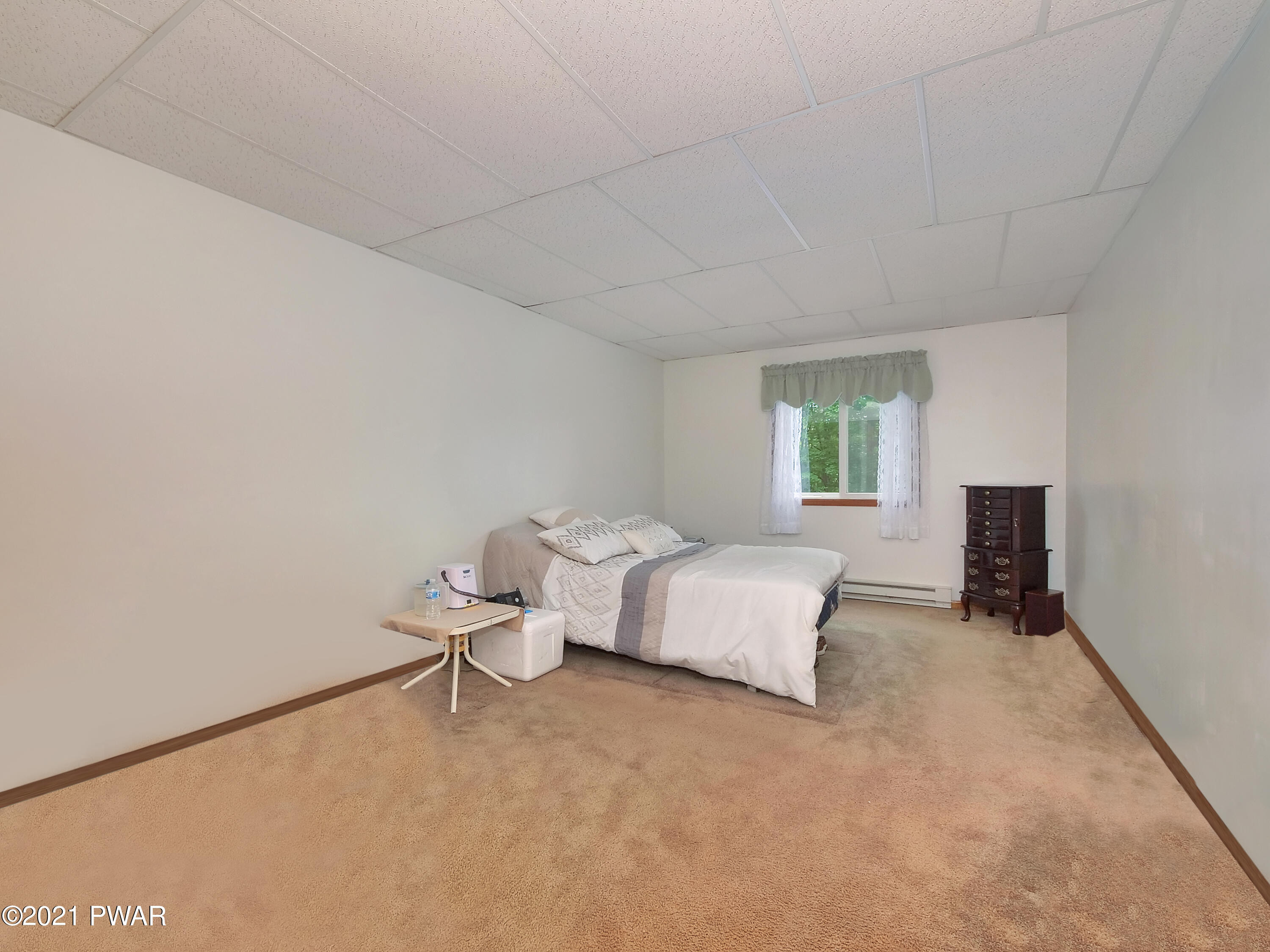 149 Yale Road Milford, PA 18337 - Photo 7 of 29 a spacious bedroom with a bed and a window