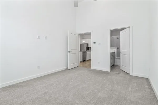 an empty room with a fireplace and painted walls