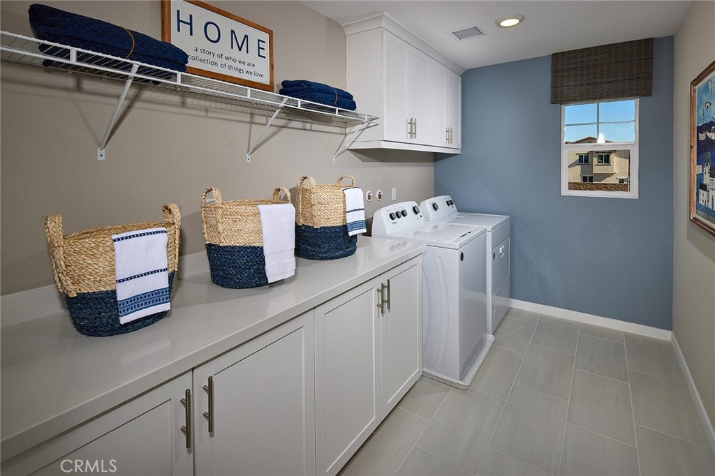 29614 Saddle Drive Winchester, CA 92596 - Photo 8 of 12 a kitchen with cabinets and window