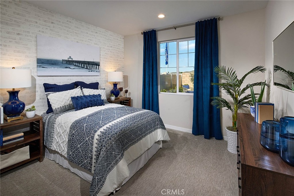 29614 Saddle Drive Winchester, CA 92596 - Photo 10 of 12 a bedroom with a large bed and a potted plant