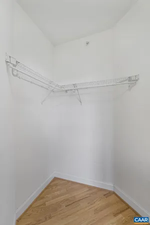 a view of a room with shelf on the wall