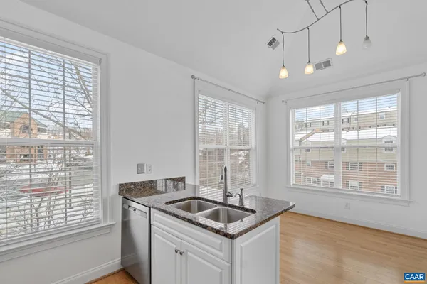 a kitchen that has a sink and a window