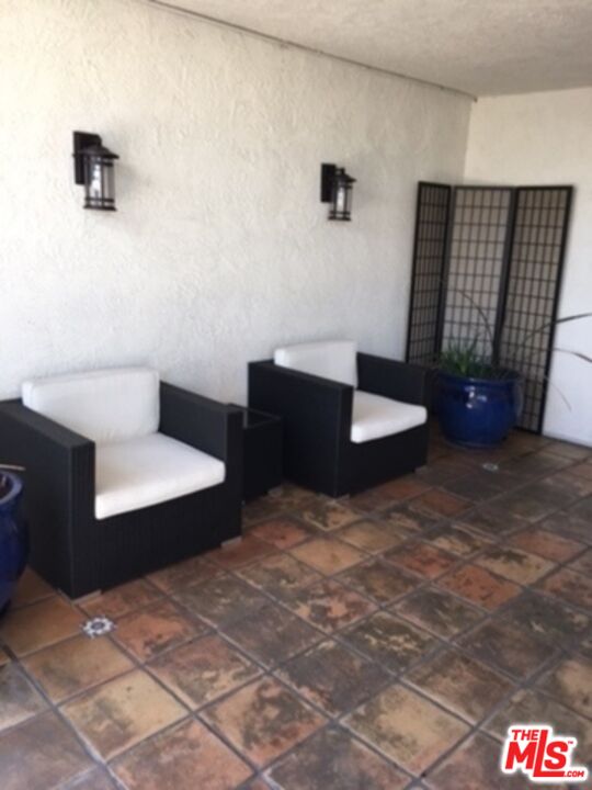 3111 4th Street, Unit 215 Santa Monica, CA 90405 - Photo 12 of 12 a living room with couch and tv