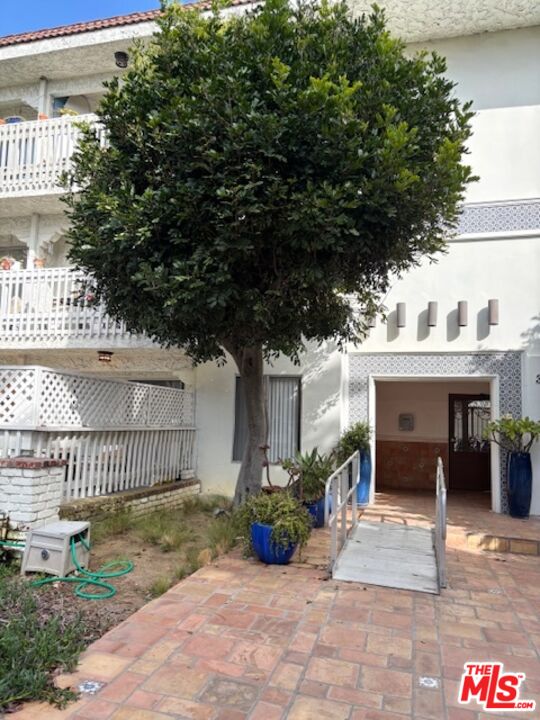 3111 4th Street, Unit 215 Santa Monica, CA 90405 - Photo 2 of 12 a view of house with outdoor seating and plants