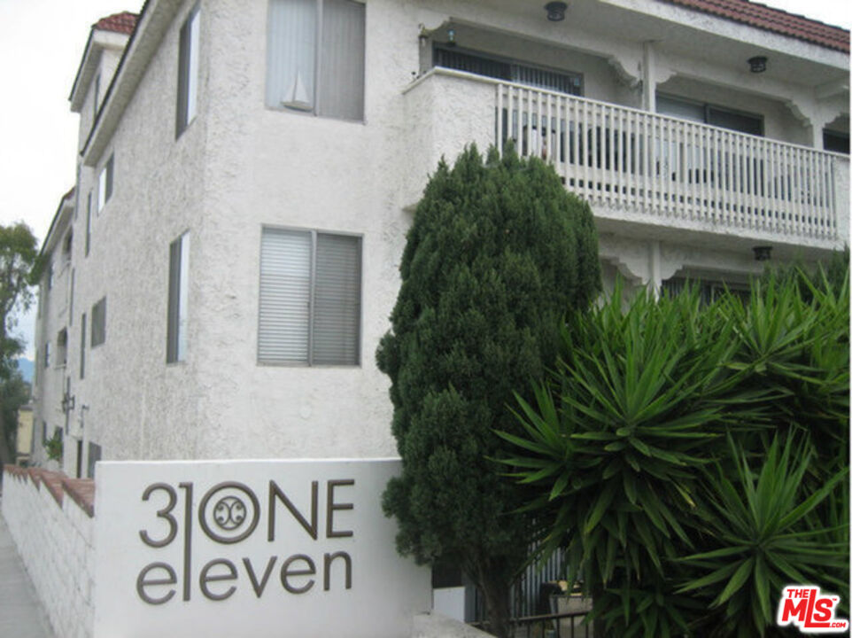 3111 4th Street, Unit 215 Santa Monica, CA 90405 - Photo 3 of 12 a view of front door and potted plants