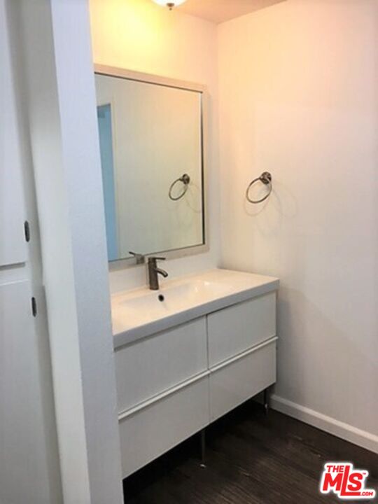 3111 4th Street, Unit 215 Santa Monica, CA 90405 - Photo 6 of 12 a bathroom with a sink and a mirror