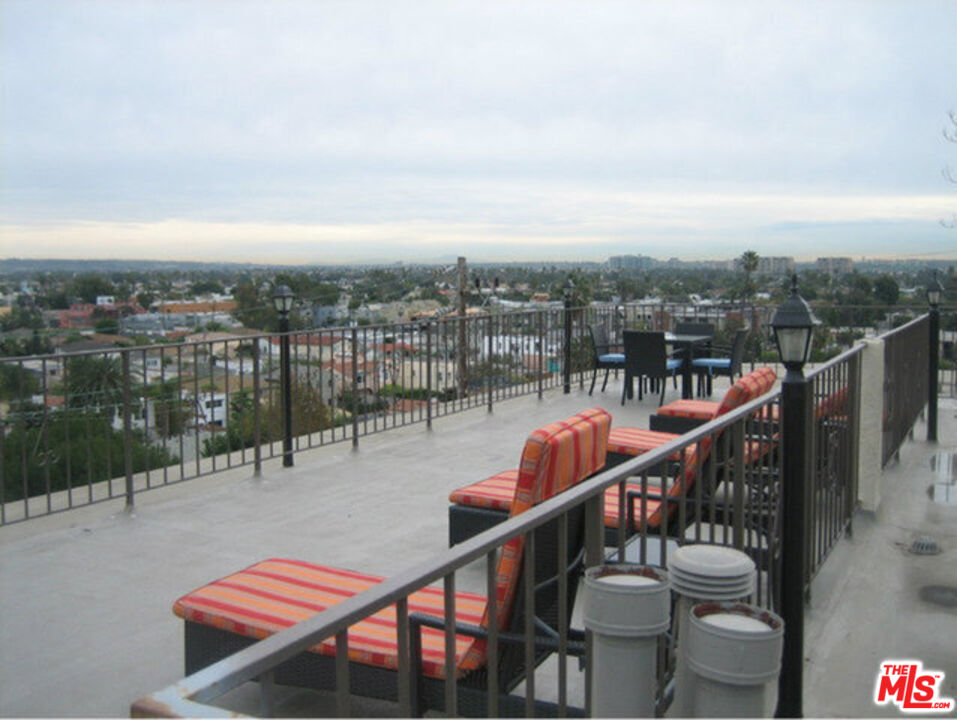 3111 4th Street, Unit 215 Santa Monica, CA 90405 - Photo 9 of 12 a balcony with wooden floor and city view