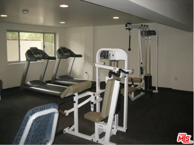 a living room with couch and tv
