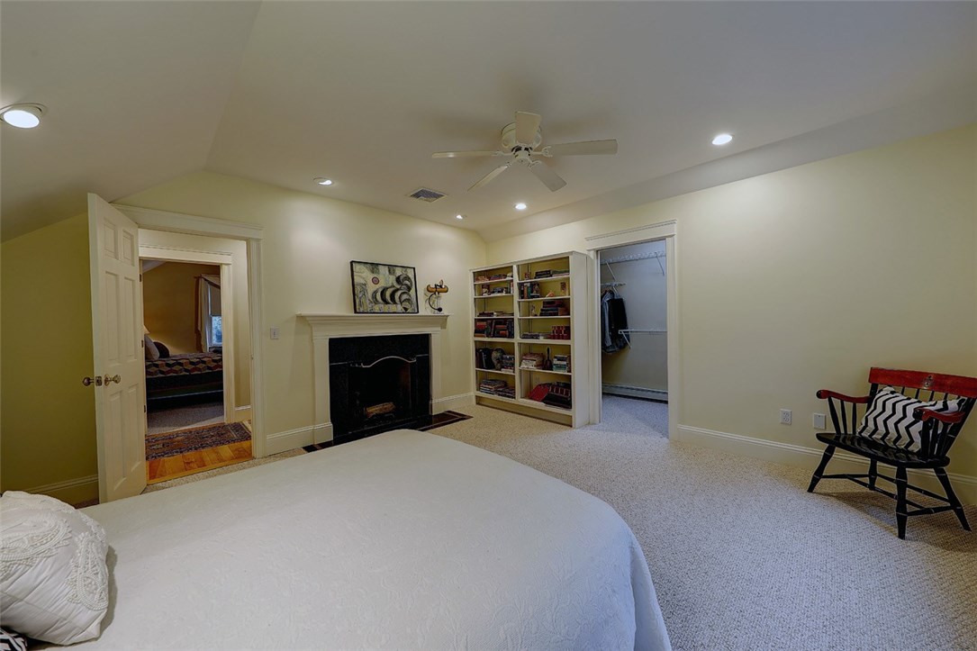 83 Rumstick Road Barrington, RI 02806 - Photo 20 of 28 Spacious 2nd floor bedroom with wood fireplace with built in bookcases and walk in closet