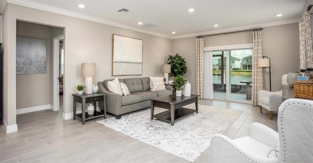 17625 Northwest 168th Road Alachua, FL 32615 - Photo 12 of 32 a living room with furniture and a potted plant
