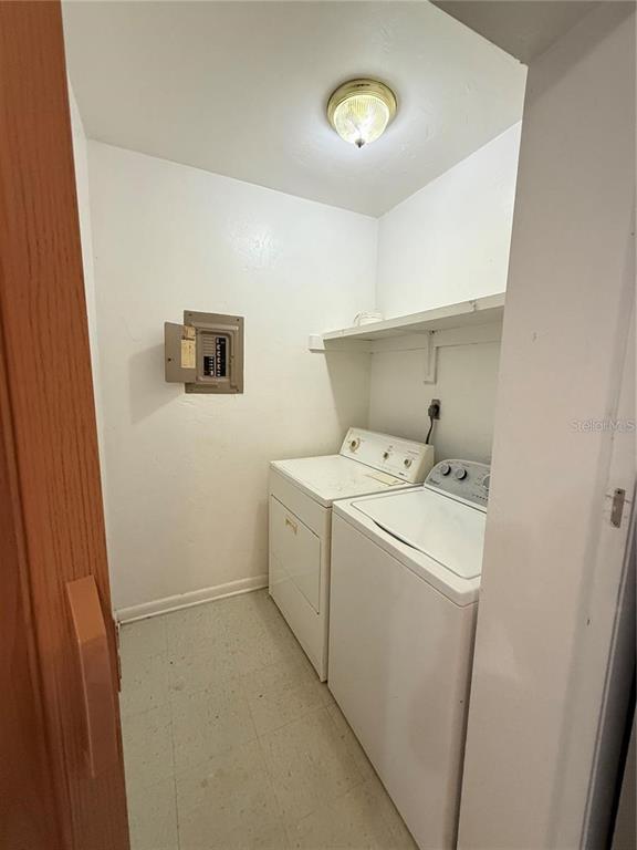 615 Southwest 11 Lane, Unit D Gainesville, FL 32601 - Photo 11 of 13 a utility room with dryer and washer