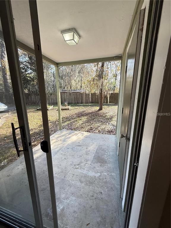 615 Southwest 11 Lane, Unit D Gainesville, FL 32601 - Photo 5 of 13 a view of a porch