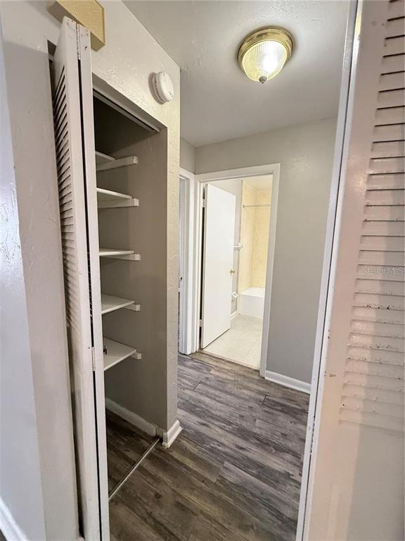 615 Southwest 11 Lane, Unit D Gainesville, FL 32601 - Photo 9 of 13 a view of a hallway with wooden floor