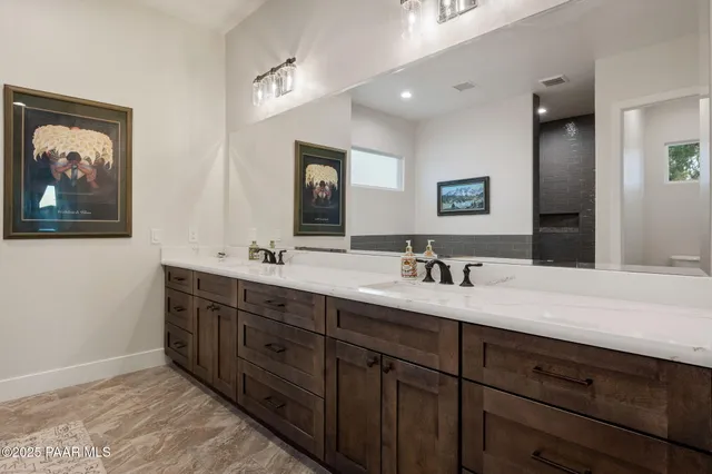 a bedroom with a bed window and a desk