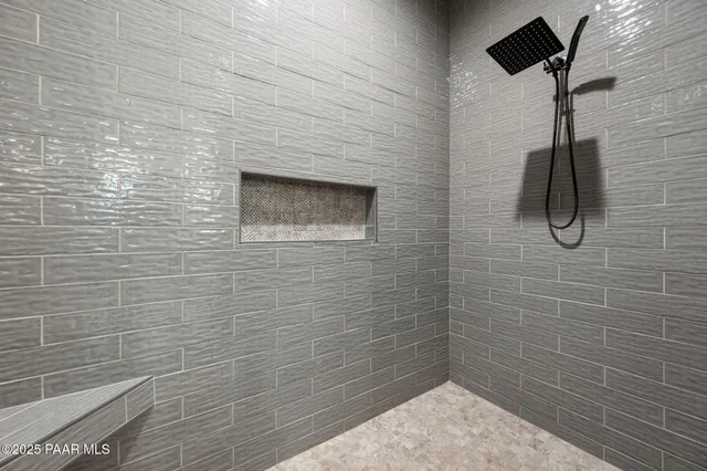 a bedroom with a bed and a table