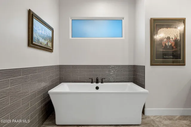 a bedroom with a bed and a sink