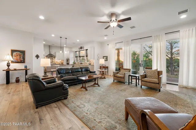 a kitchen with stainless steel appliances kitchen island granite countertop a stove a sink and a microwave