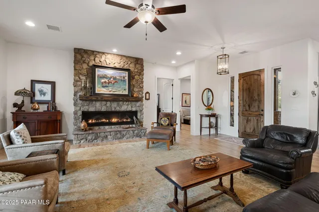 a dining room with furniture a rug and wooden floor