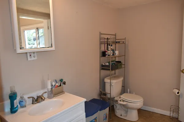 a bathroom with a sink a washer and dryer