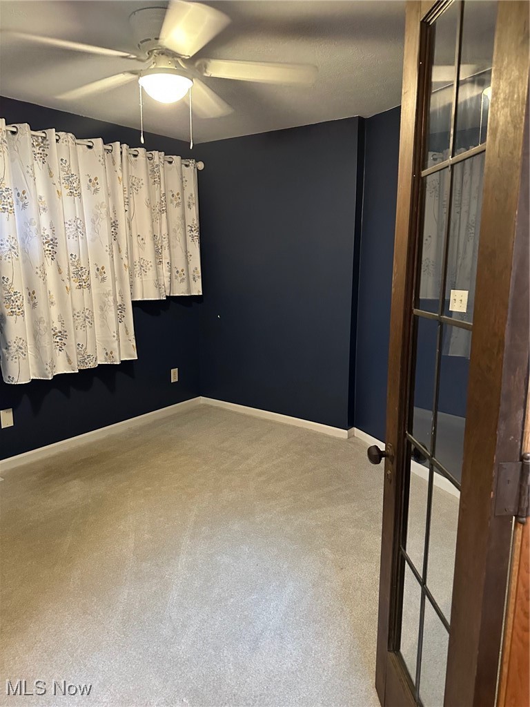 1224 Ridge Road Salem, OH 44460 - Photo 24 of 48 Carpeted spare room with ceiling fan and baseboards