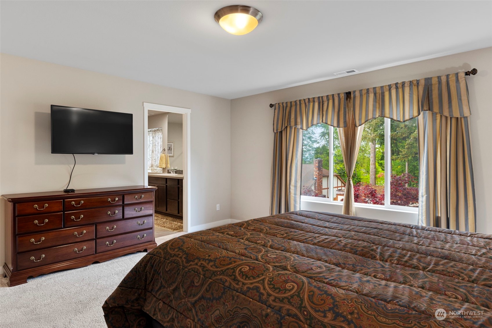 9229 5th Drive Southeast Everett, WA 98208 - Photo 17 of 33 a bedroom with a bed and a flat screen television