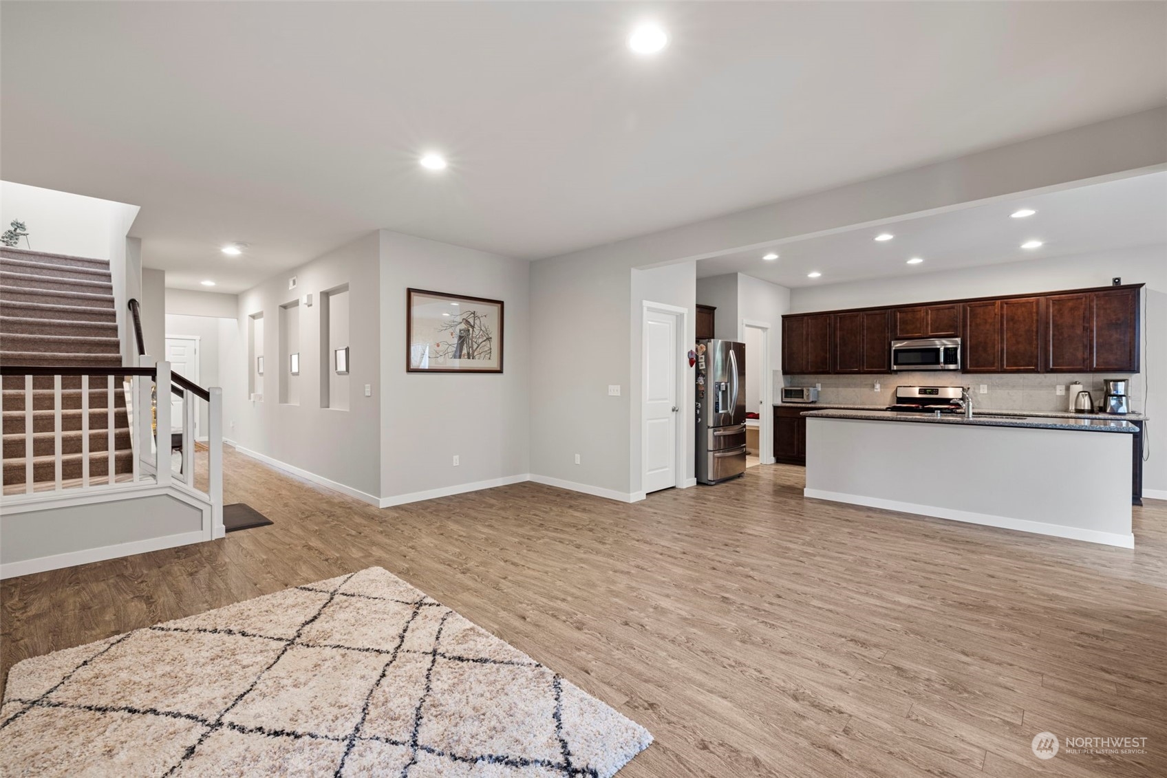 9229 5th Drive Southeast Everett, WA 98208 - Photo 4 of 33 a view of a kitchen with a sink and a refrigerator