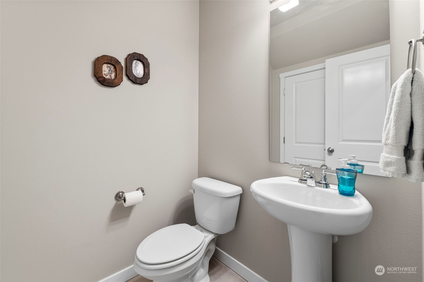 9229 5th Drive Southeast Everett, WA 98208 - Photo 9 of 33 a bathroom with a sink a toilet and a mirror