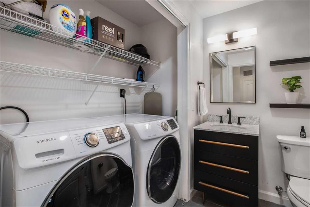 3475 Oak Valley Road Northeast, Unit 1630 Atlanta, GA 30326 - Photo 21 of 38 a utility room with dryer and washer