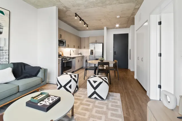 a view of a livingroom with furniture and a table