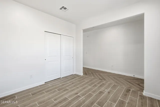 a view of an empty walk in closet