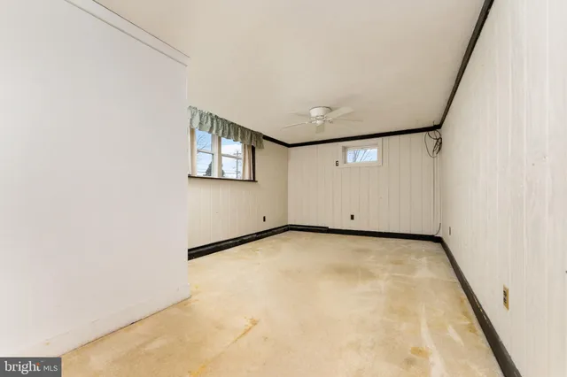 a kitchen with a sink cabinets and a window