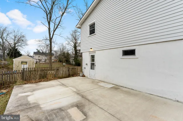 a view of a yard with a large tree
