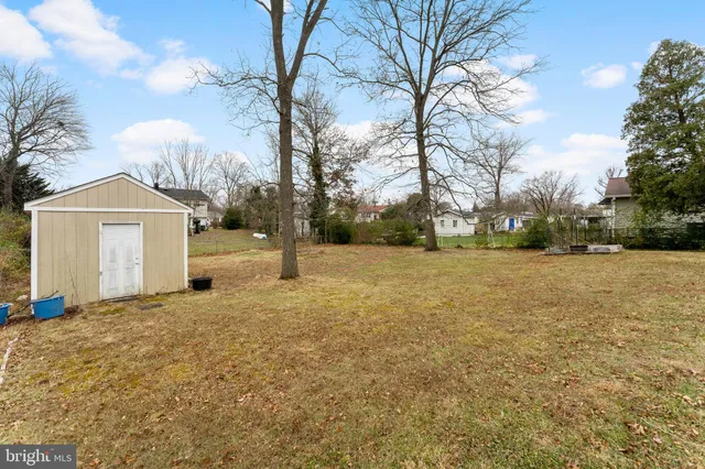a house with trees in the background