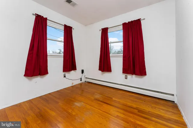 a room with a bed and a window