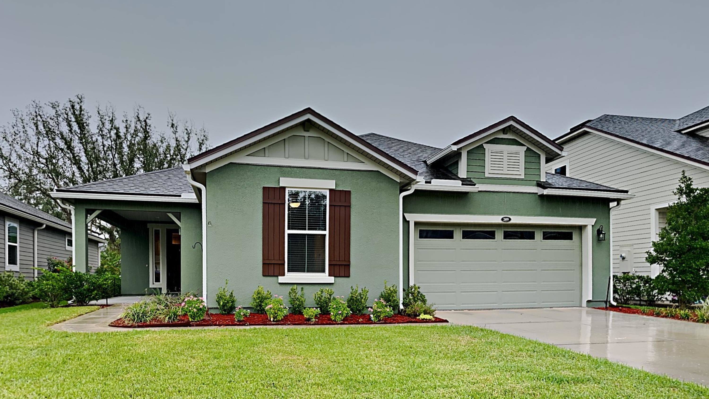 a front view of a house with a yard