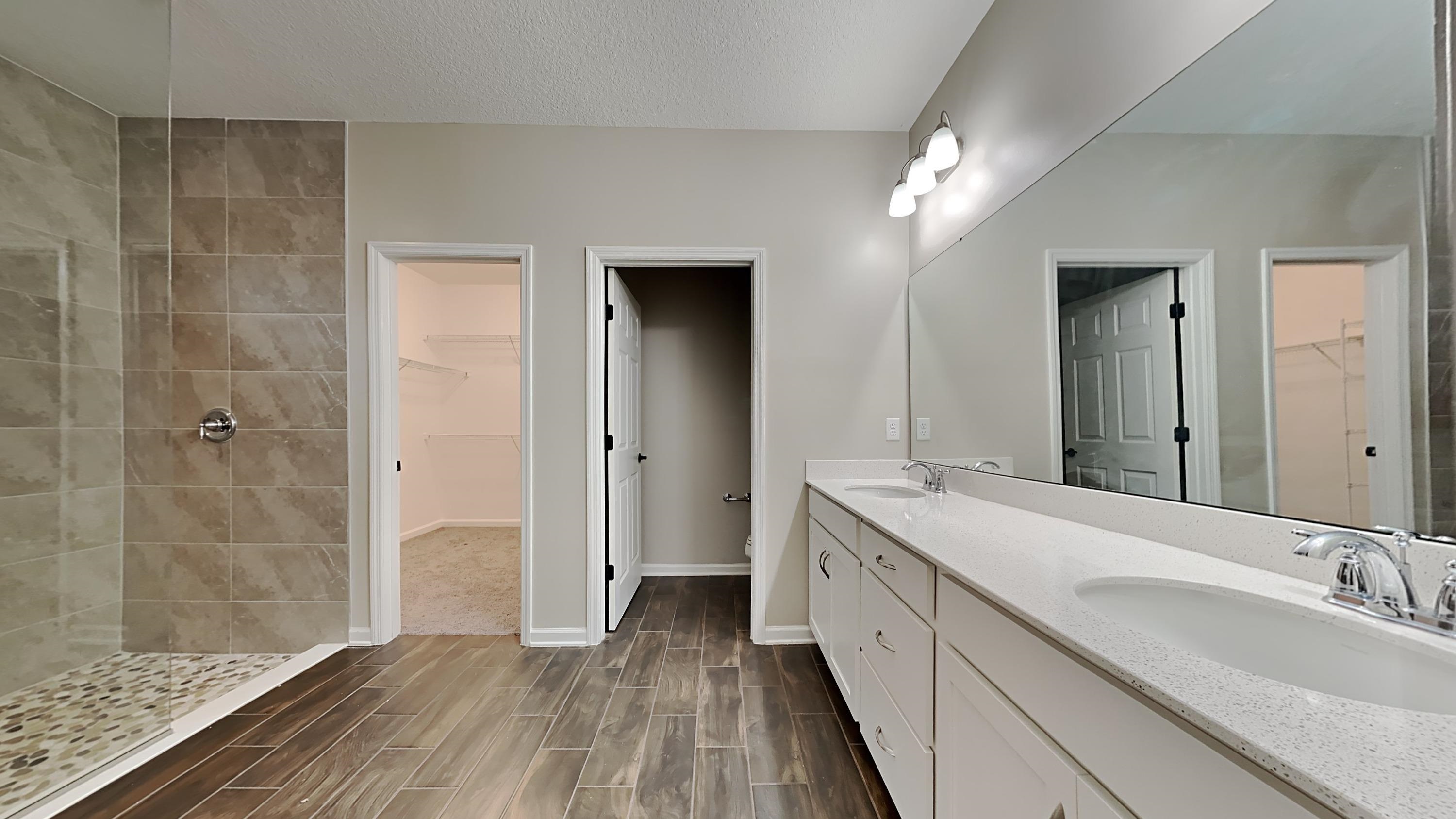 209 Cloverbrook Road St. Johns, FL 32259 - Photo 9 of 13 a spacious bathroom with a double vanity sink and a mirror