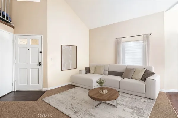 a living room with furniture and a rug