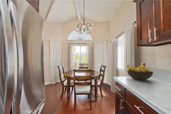 a dining room with furniture and window
