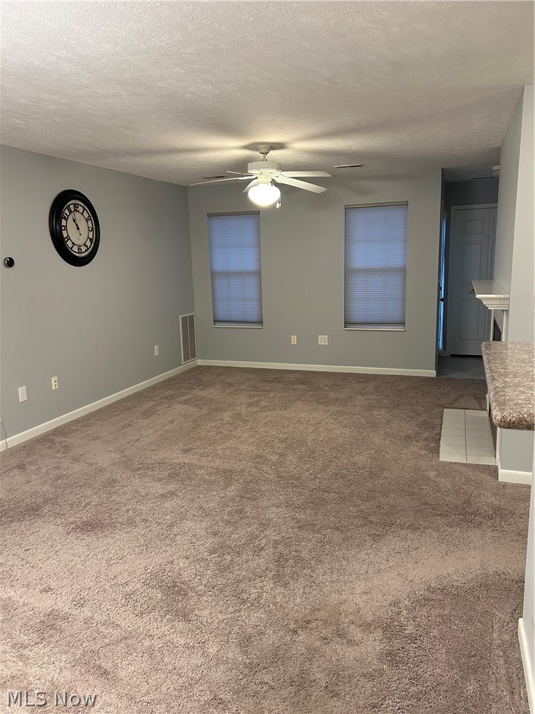 28340 Center Ridge Road, Unit 114 Westlake, OH 44145 - Photo 3 of 19 The large living room features newer carpet.