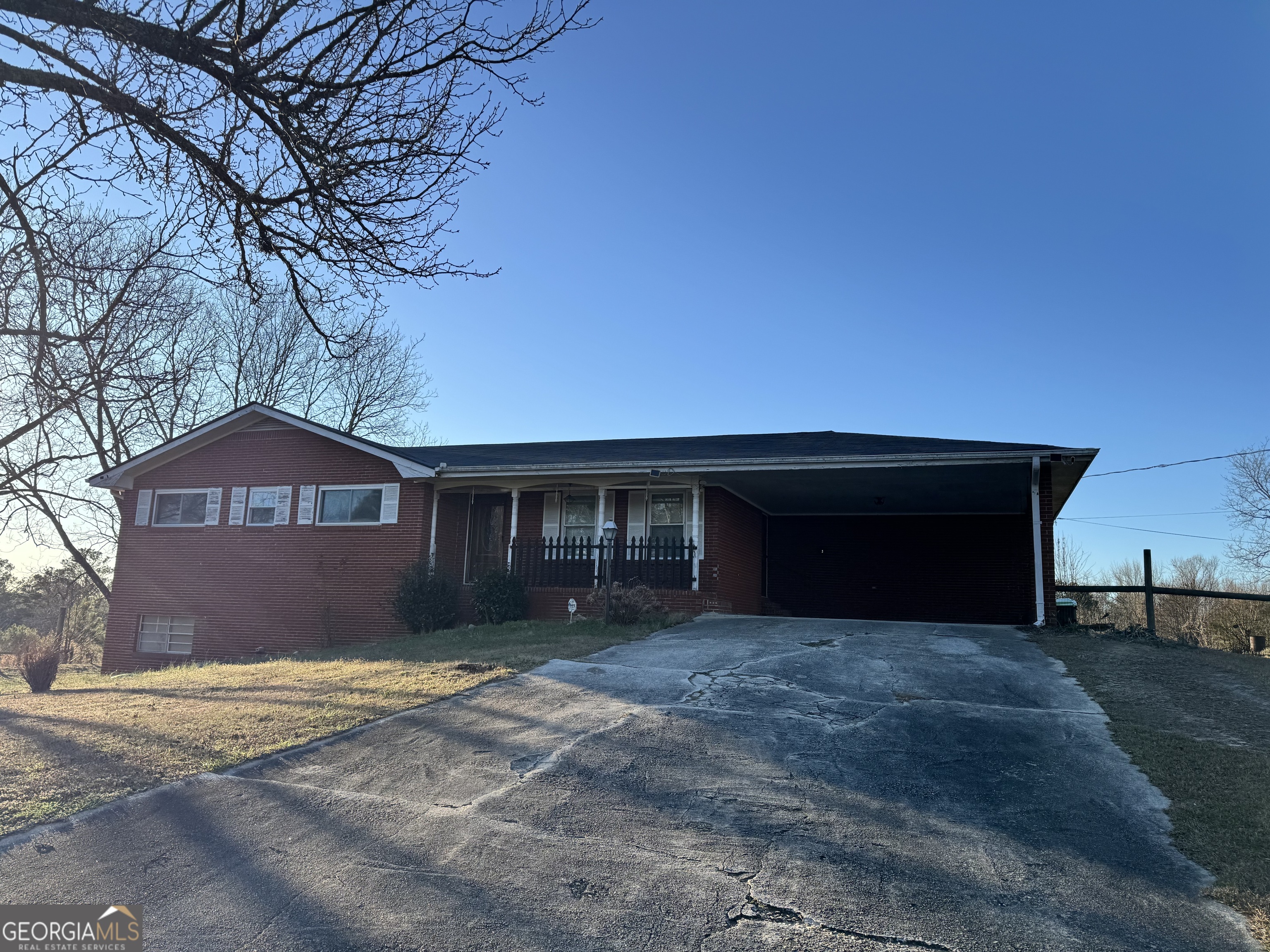 2324 Wilson Road Northwest Conyers, GA 30012 - Photo 1 of 13 a front view of a house with a yard and garage