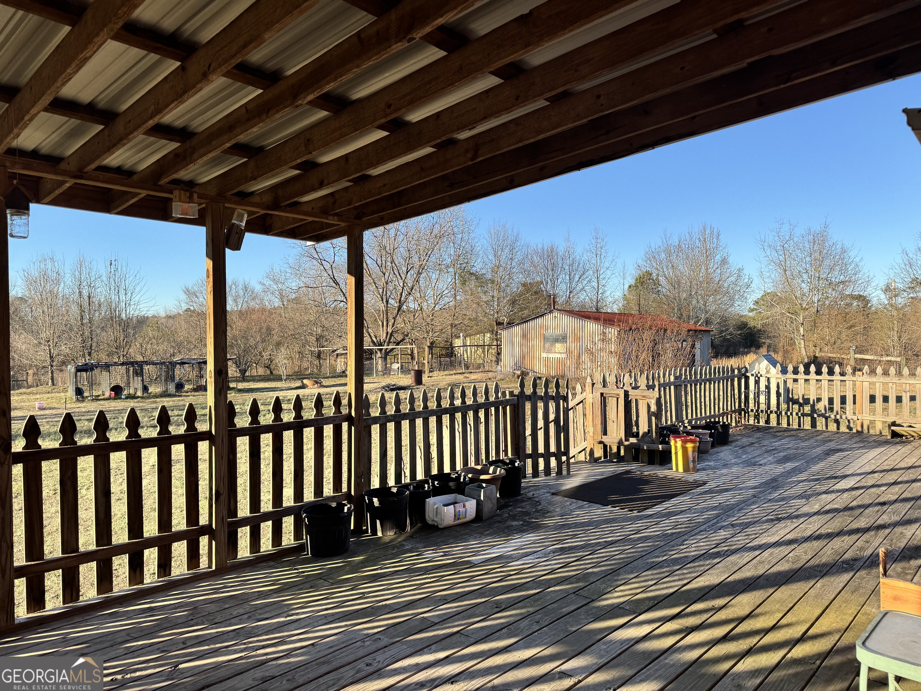2324 Wilson Road Northwest Conyers, GA 30012 - Photo 12 of 13 a view of a porch with wooden floor of the house