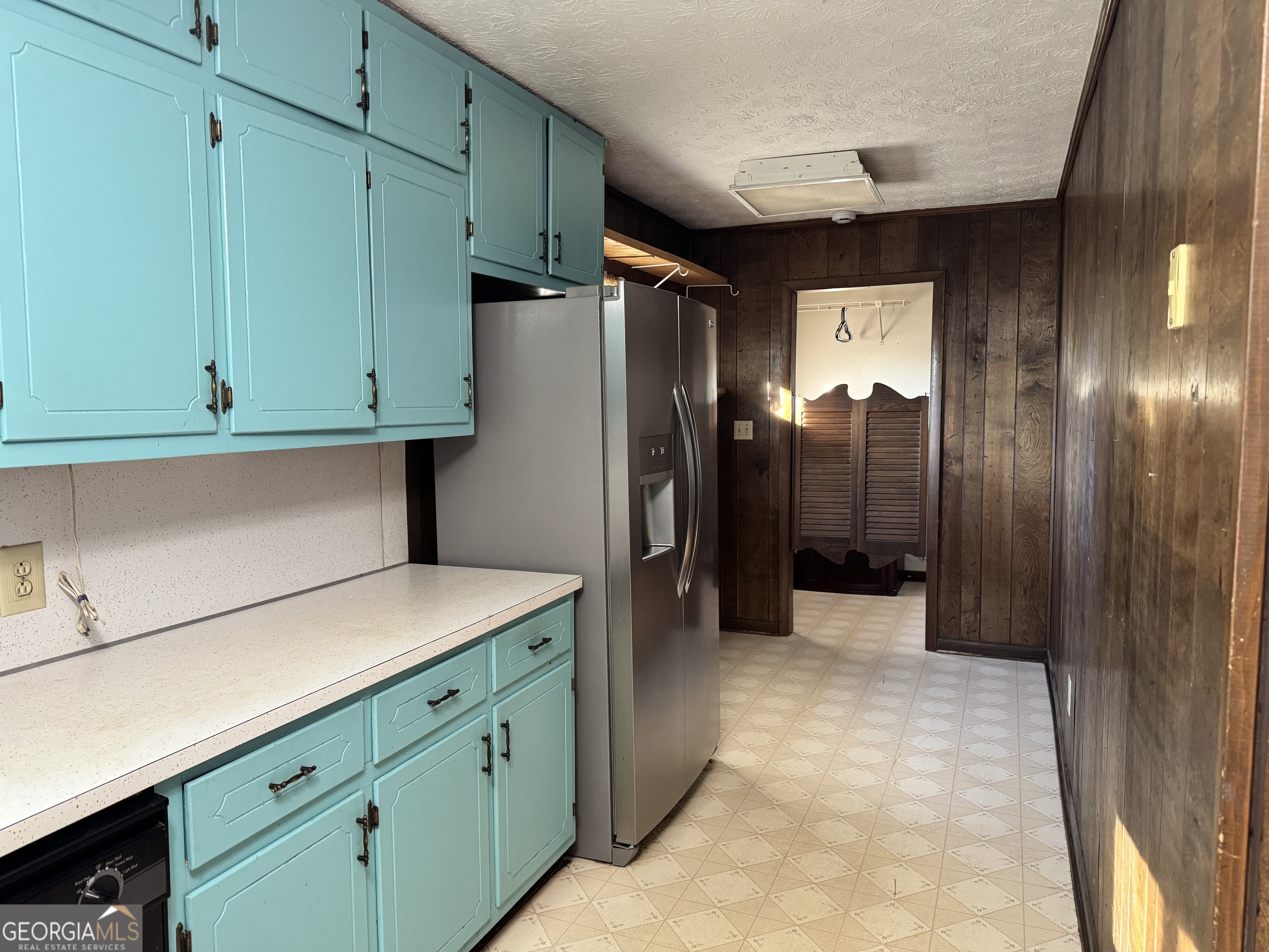 2324 Wilson Road Northwest Conyers, GA 30012 - Photo 6 of 13 a kitchen with cabinets and stainless steel appliances