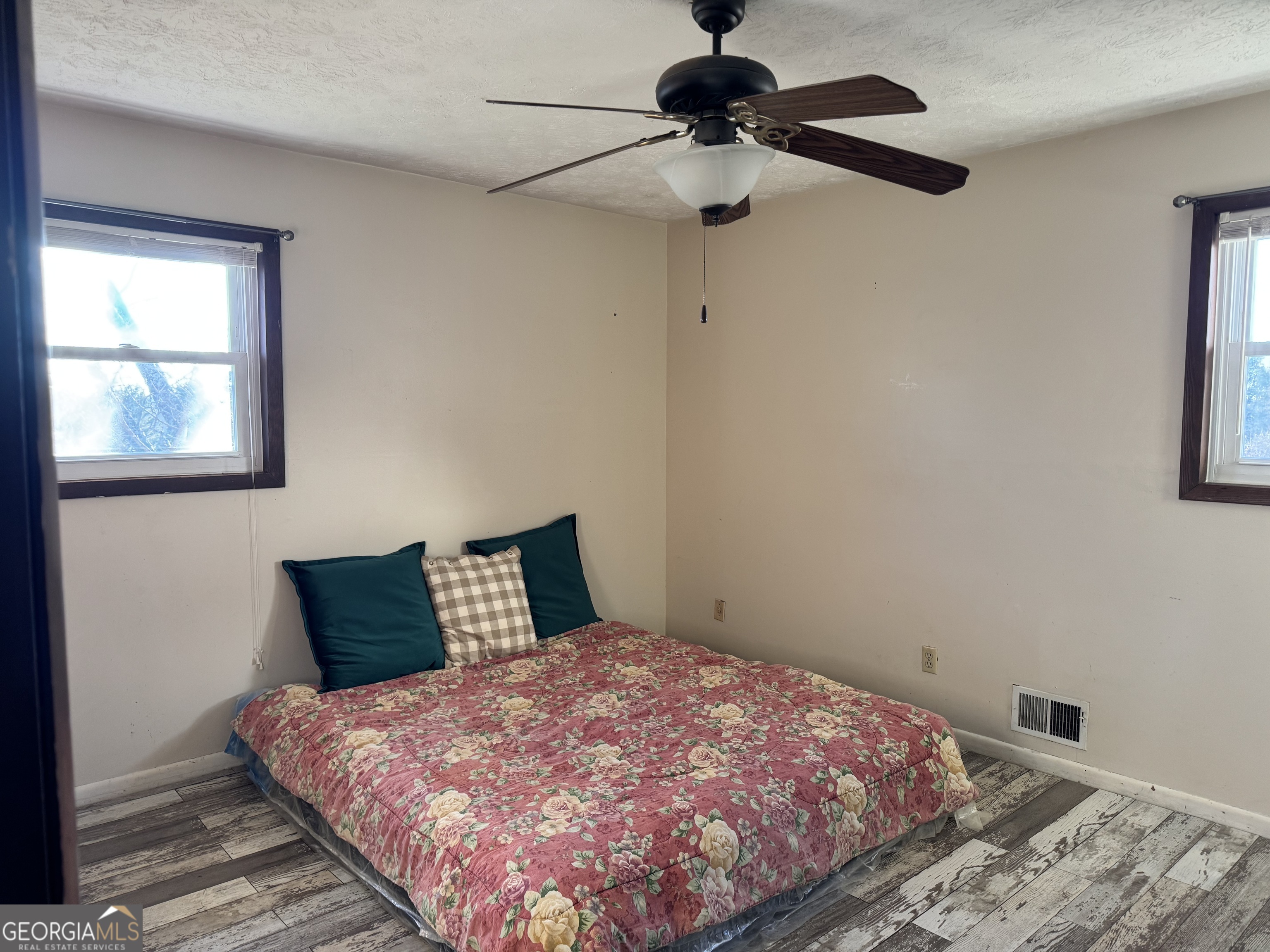 2324 Wilson Road Northwest Conyers, GA 30012 - Photo 9 of 13 a bedroom with a bed and a window