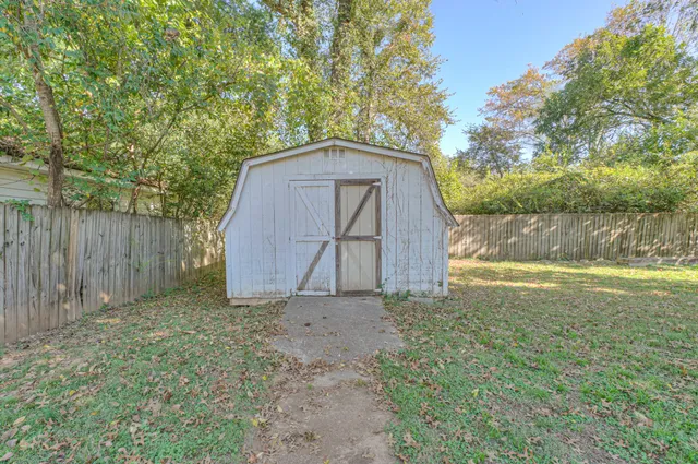 a backyard of a house with lots of green space