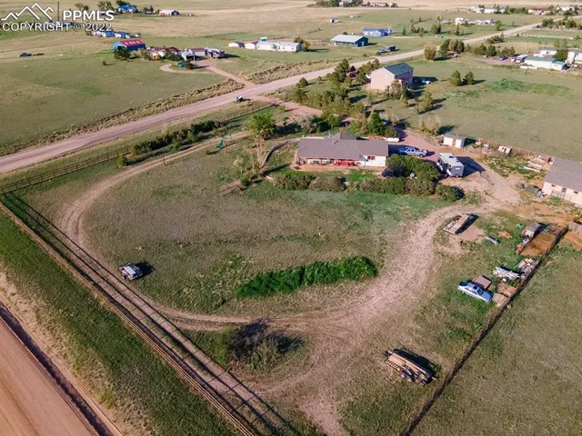 an aerial view of houses with outdoor space