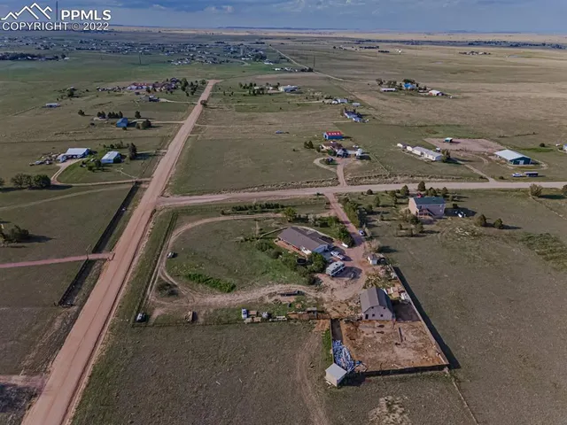 a view of a lake with houses in the back