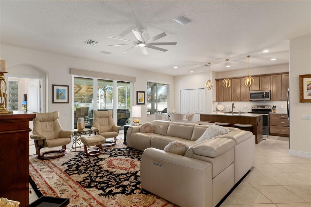14617 Balloch Drive Hudson, FL 34667 - Photo 11 of 76 a living room with furniture and a large window