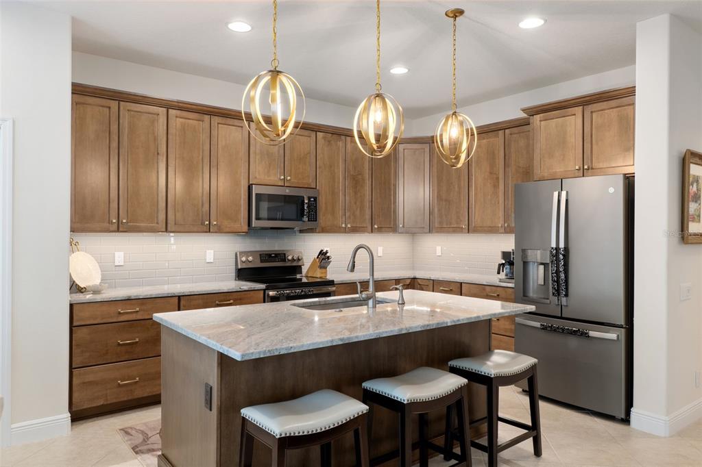 14617 Balloch Drive Hudson, FL 34667 - Photo 16 of 76 a kitchen with a sink cabinets and stainless steel appliances