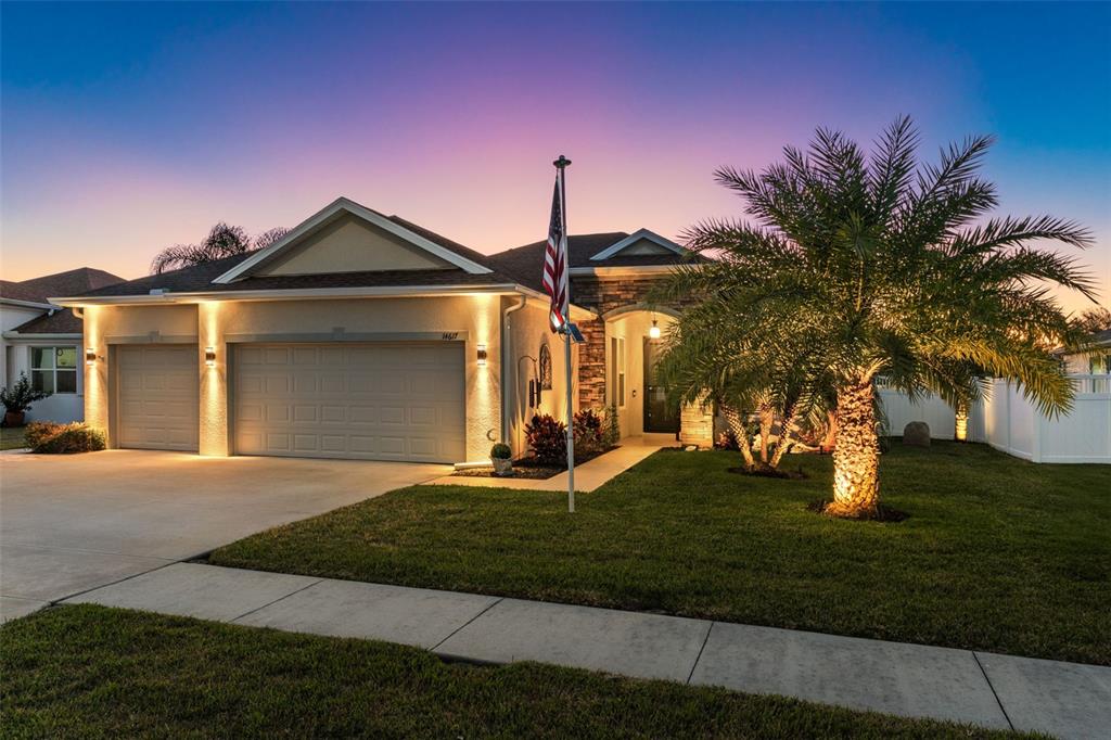 14617 Balloch Drive Hudson, FL 34667 - Photo 4 of 76 a front view of a house with a yard
