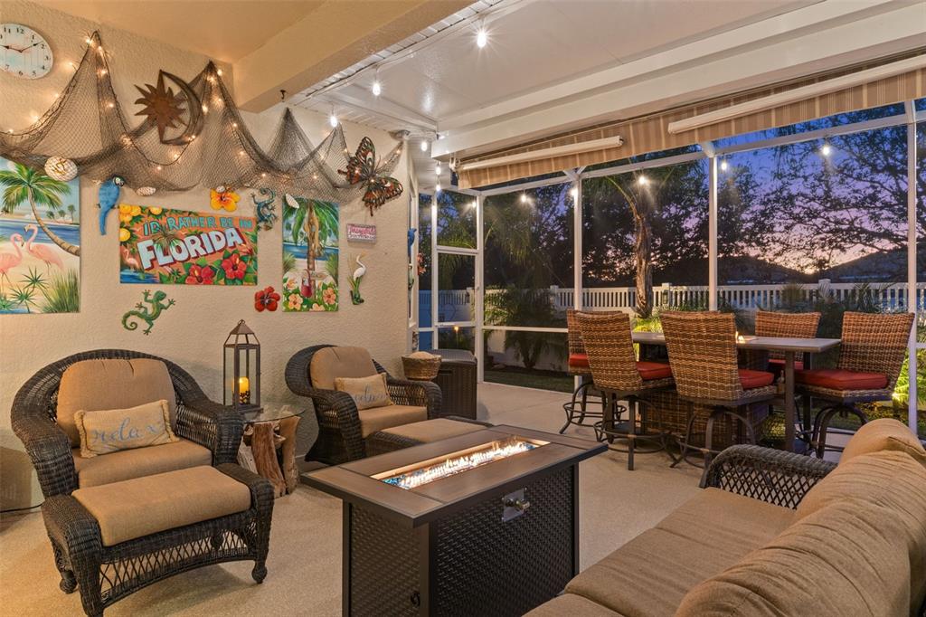 14617 Balloch Drive Hudson, FL 34667 - Photo 47 of 76 a living room with furniture a lamp and a potted plant